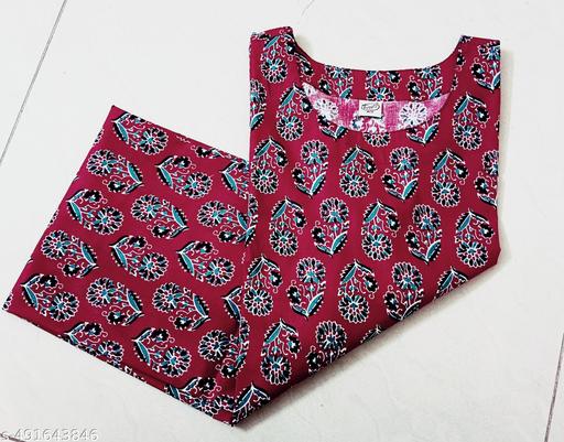 Vibrant and Striking Rust Color Kurti with Intricate White and Black Printed Patterns for a Stylish Contemporary Look