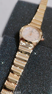 S K Enterprise Elegant gold-tone women's wristwatch with sparkling rhinestone embellishments and a quartz movement.