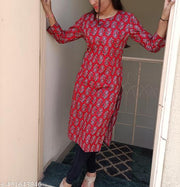 Vibrant and Striking Rust Color Kurti with Intricate White and Black Printed Patterns for a Stylish Contemporary Look