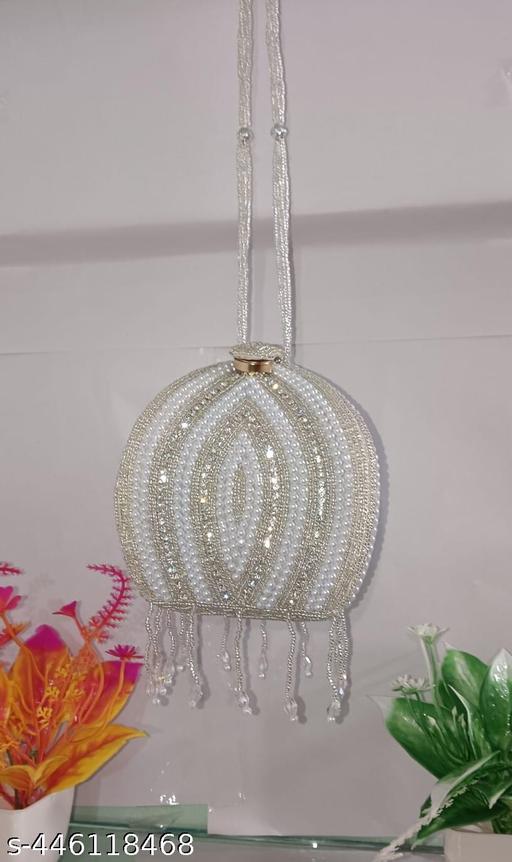 REAL LIFE STUNNING FABULOUS AND DELUXE FESTIVE/PARTY/WEDDING/BRIDAL POTLI FOR WOMEN